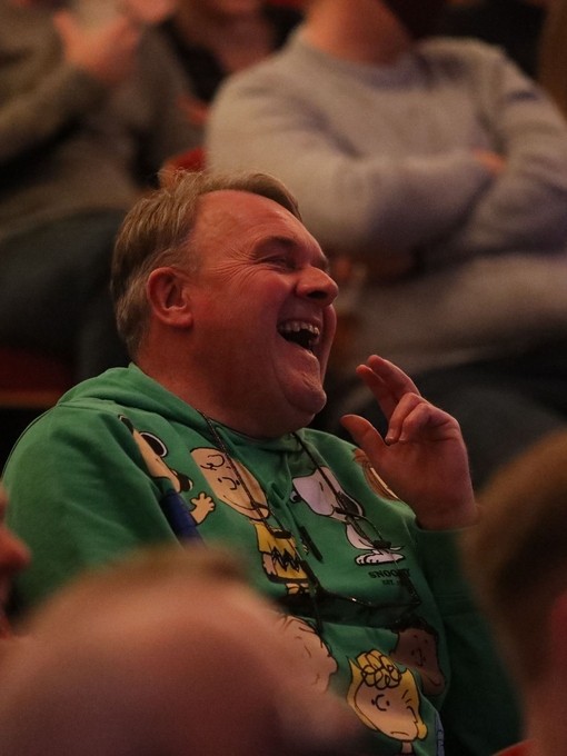 An audience member laughing during a show at Leicester's Comedy Festival
