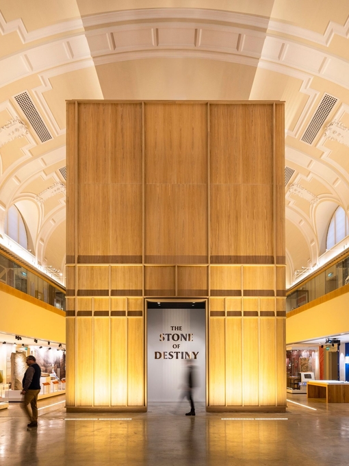 Exhibition hall of a modern museum with a sign reading 'The Stone of Destiny'.