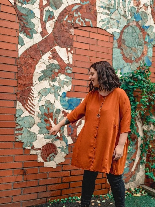 Standing infront of a mural