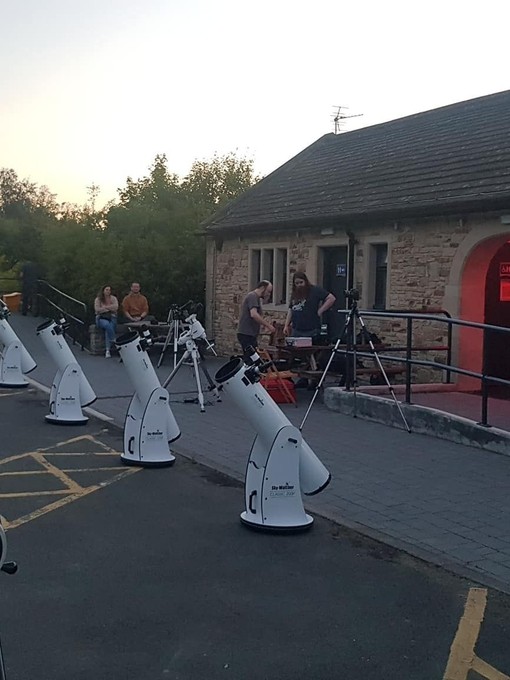 Rows of telescopes being prepared for an evening of stargazing at Grassholme Observatory, Durham