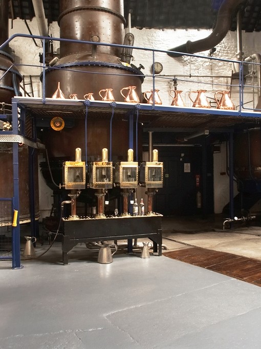 Distillery machines lining the wall at Plymouth Gin
