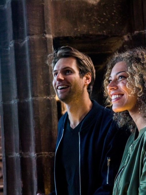 Two people touring Chester Cathedral