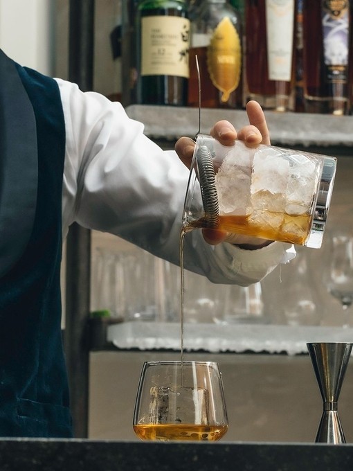 Bartender pouring a whisky drink at the Lakes Distillery