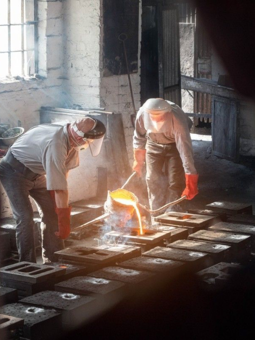 A group of workers pouring steel at Ironbridge Gorge, one of the starting places of the Industrial Revolution