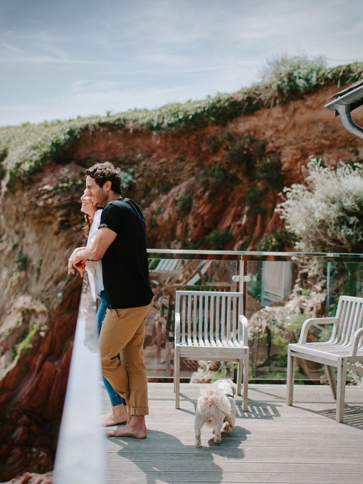 Couple on a terrace looking out