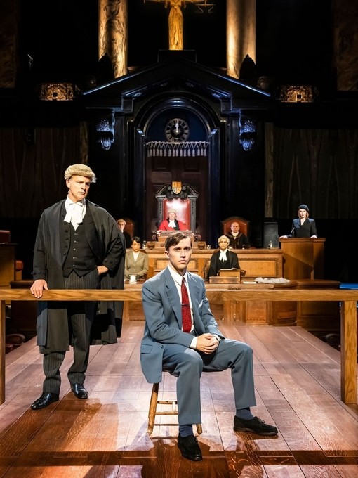 Actors in legal costume ready to perform a play in front of an audience.
