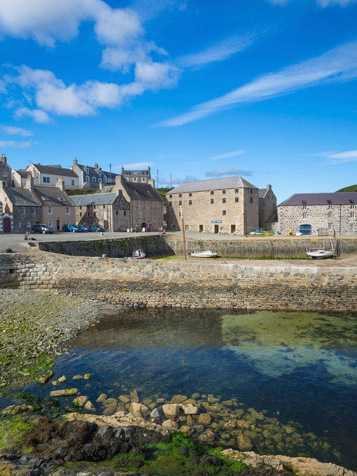 A landscape shot of a harbour town on a sunny day.