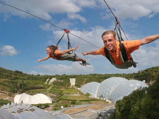 Two friends enjoying a zipline experience.