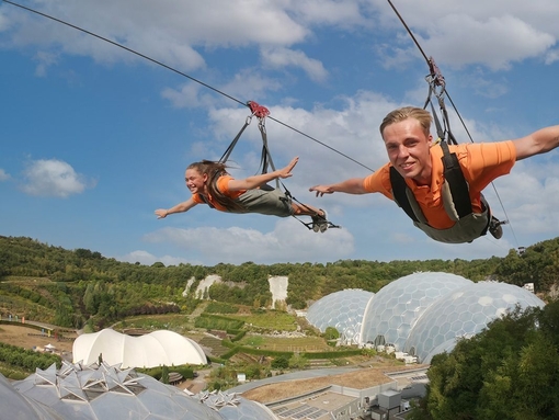 Two friends enjoying a zipline experience.