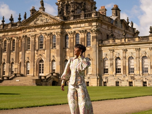A woman stands outside a heritage property