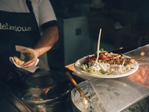 Chef serving up food at Abergavenny Food Festival, Wales