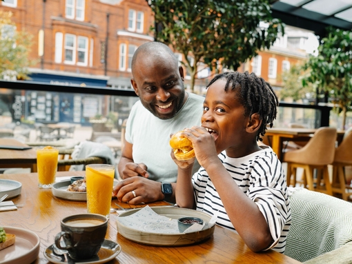 Father and son enjoying brunch at a restaurant