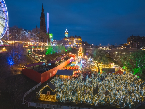 A night view over Princes Street Gardens with the Christmas Market lights