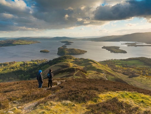 Walkers taking in the view of Loch Lomond from Conic Hill part of the West Highland Way