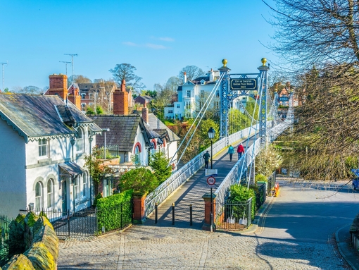 View of residential houses alongside river Dee in Chester, England.