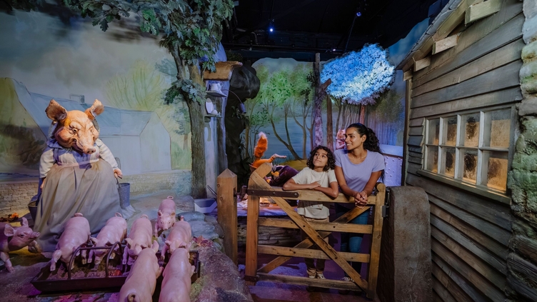 Mother and son looking around at a rabbit themed exhibition.
