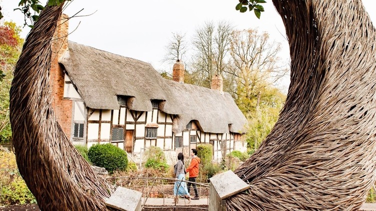 Crescent shaped bench outside Anne Hathaway's cottage, Stratford-upon-Avon