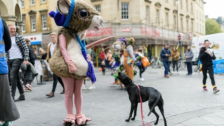 A dog and a performer in a mouse costume as part of Bath Fringe Festival