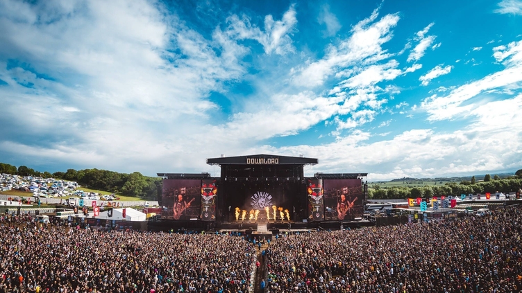 A large crowd watching a performance at Download Festival's main stage