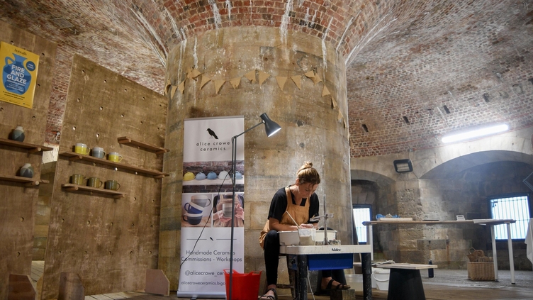 A ceramics artist at work in a studio