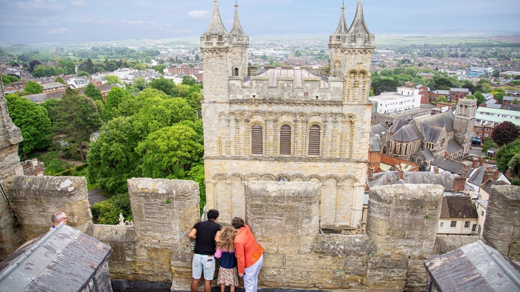 Aerial view of people looking down from a tower at Exeter Cathedral