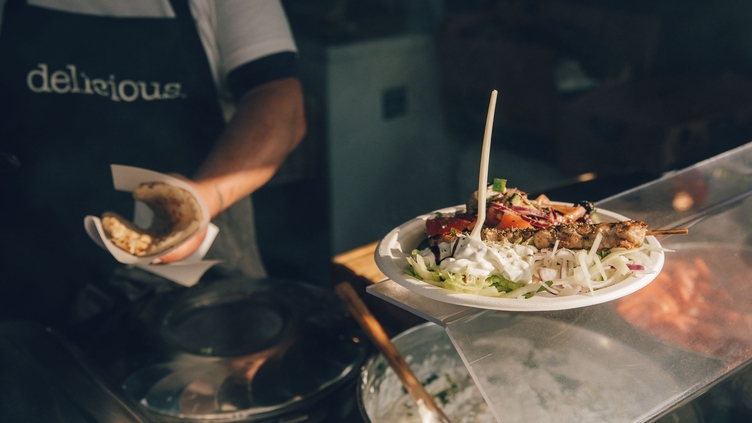 Chef serving up food at Abergavenny Food Festival, Wales