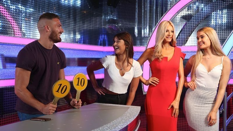 A couple enjoying waxworks at Madame Tussauds Blackpool.