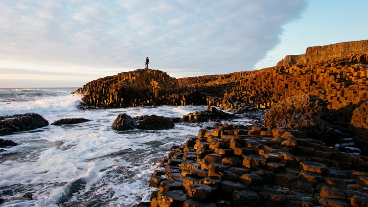 Sunset over the red basalt column. Sea views