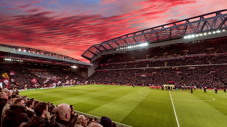 Red clouds in sunset over the ground of a stadium