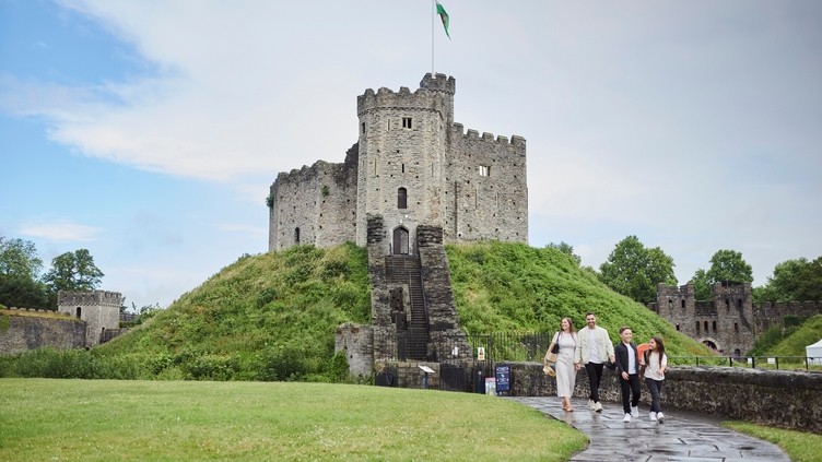Family walking in front of Cardiff Castle