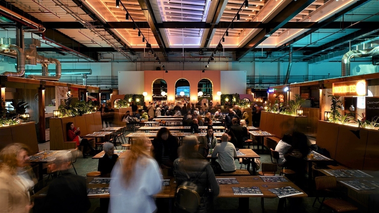 People eating food and drinking in Chester Market