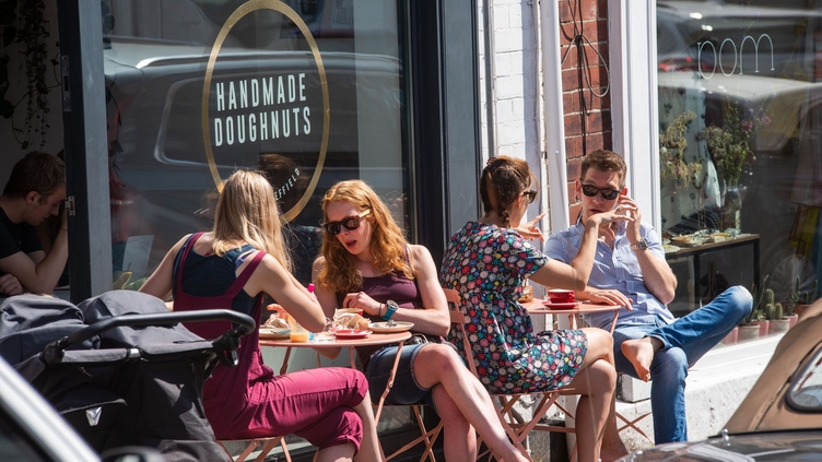 Groups of people sitting outside Handmade Doughnuts in Sheffield