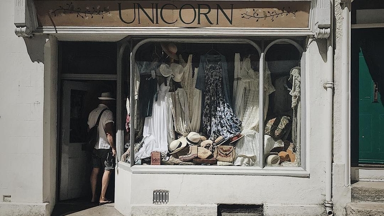Man walking into a boutique style vintage shop