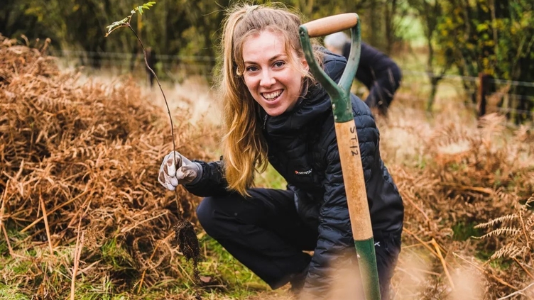 A young girl gardening at Kingley Vale
