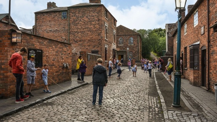 People on a cobbled street of Black Country Living Museum
