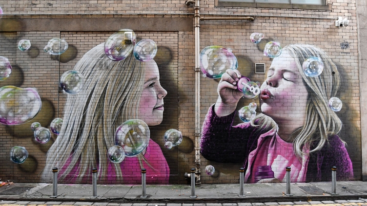 Mural on wall of kids blowing bubbles, Glasgow Mural Trail