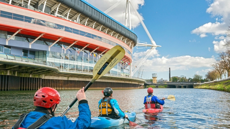 Kayakers passing Millennium Stadium