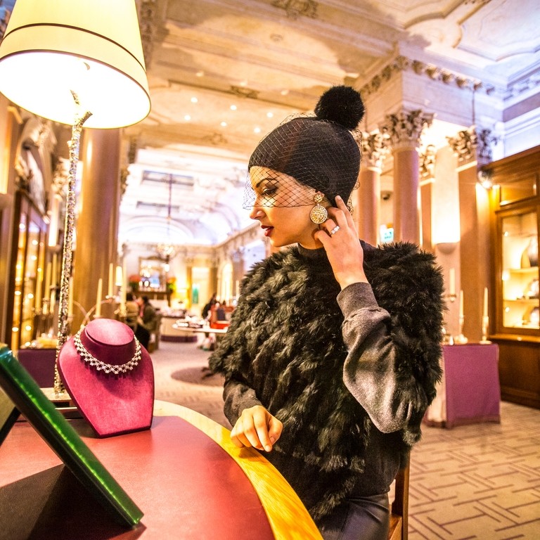 Hamilton & Inches, Warrant Holders to Her Majesty the Queen, are Scotland's leading jewellery and luxury goods store. A young Arabic woman shopping.