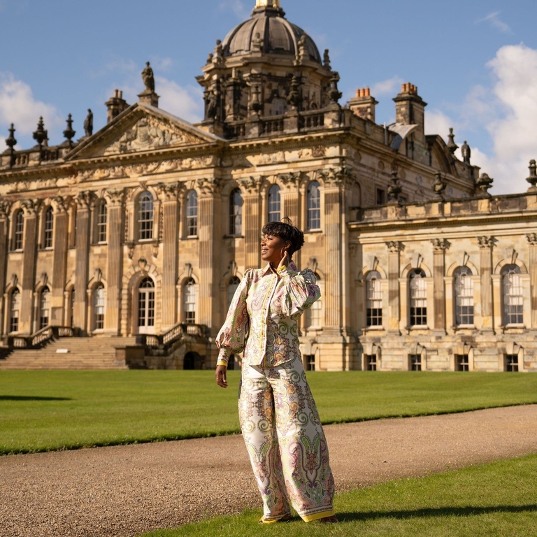 A woman stands outside a heritage property