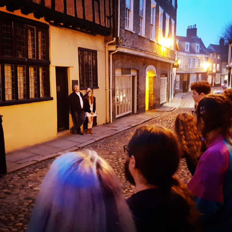 A group on a ghost walk tour of Norwich