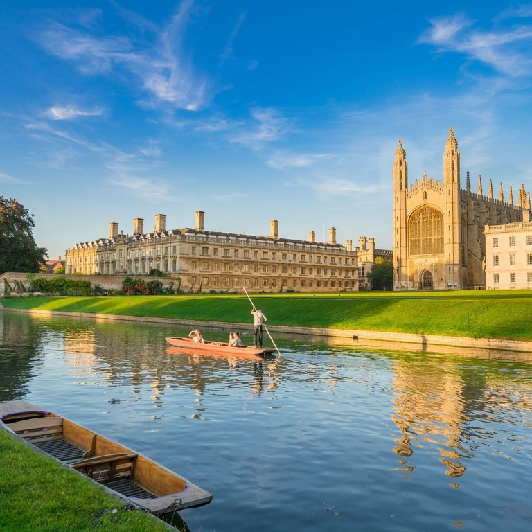 View of college in Cambridge with people punting on River