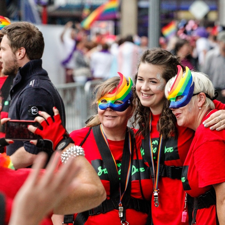 Group of people having their photograph taken at an event