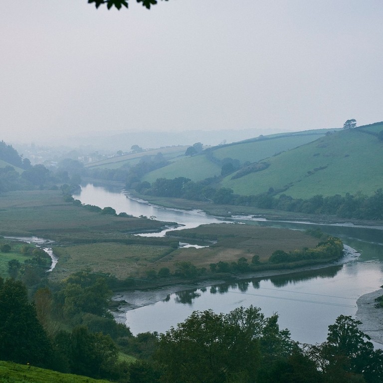High angle landscape view of a river running through a valley.