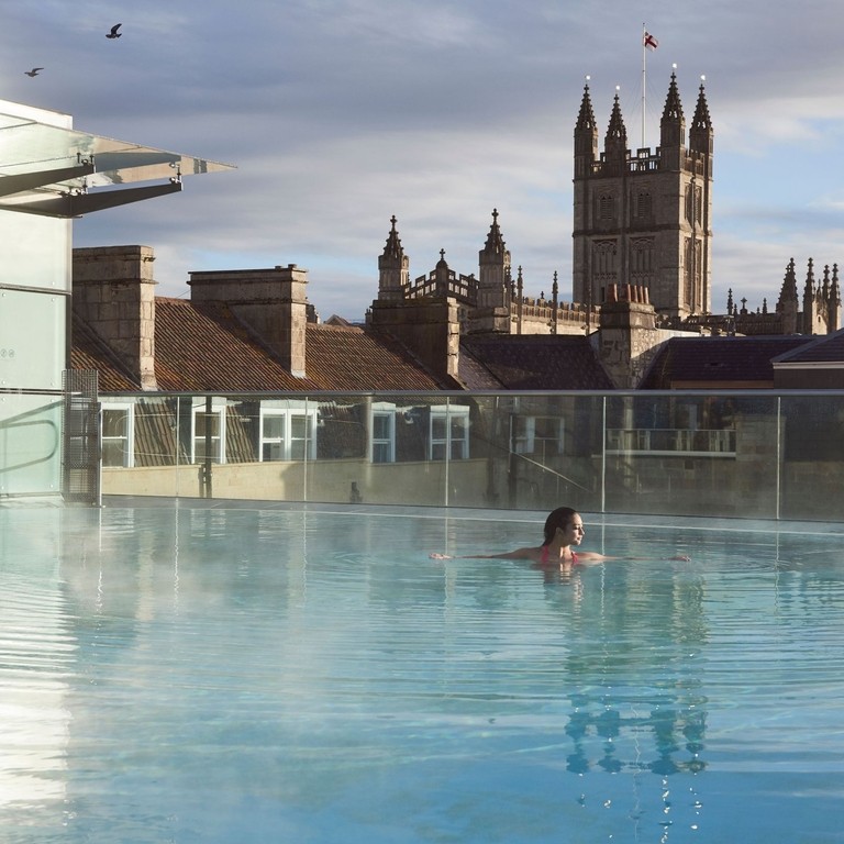 Woman swimming in a swimming pool at a spa