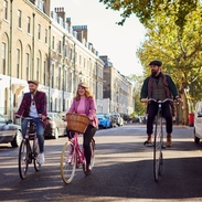 Tally Ho! Gin Safari experience tour guides and tourists cycling around London