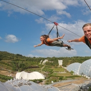 Two friends enjoying a zipline experience.