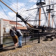 A woman and a man visiting a heritage naval museum