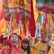 Performers in colourful Chinese costumes performing
