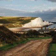Country road with white cliffs in the background
