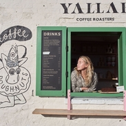 Women looking through shop window of a coffee shop
